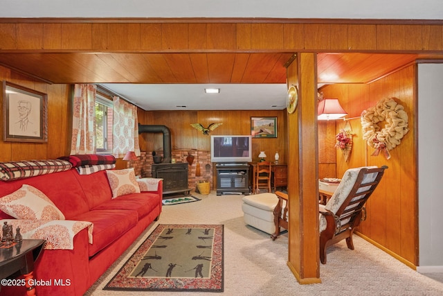 22 Sylvan Ct, Clifton Park, NY 12065 - carpeted living area featuring a wood stove, wooden walls, and wood ceiling