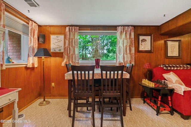 22 Sylvan Ct, Clifton Park, NY 12065 - dining area featuring wooden walls and carpet flooring