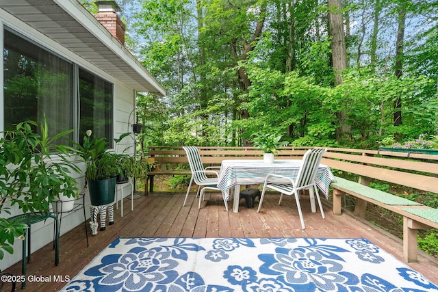 22 Sylvan Ct, Clifton Park, NY 12065 - wooden terrace with view of scattered trees and outdoor dining space
