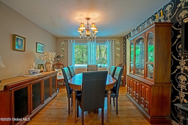 22 Sylvan Ct, Clifton Park, NY 12065 - dining space featuring light wood-type flooring and a chandelier