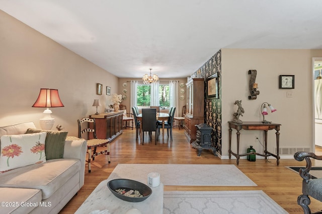 22 Sylvan Ct, Clifton Park, NY 12065 - living room featuring a chandelier and wood finished floors