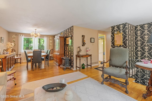 22 Sylvan Ct, Clifton Park, NY 12065 - living room with a chandelier and light wood-style floors