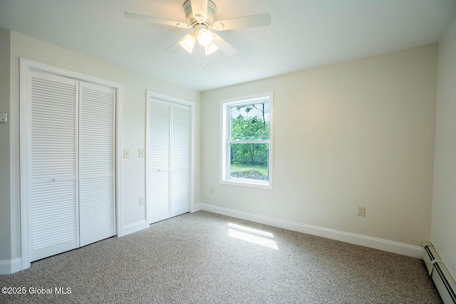 11 N Park St, White Creek, NY 12816 - unfurnished bedroom with a baseboard radiator, two closets, carpet, and baseboards