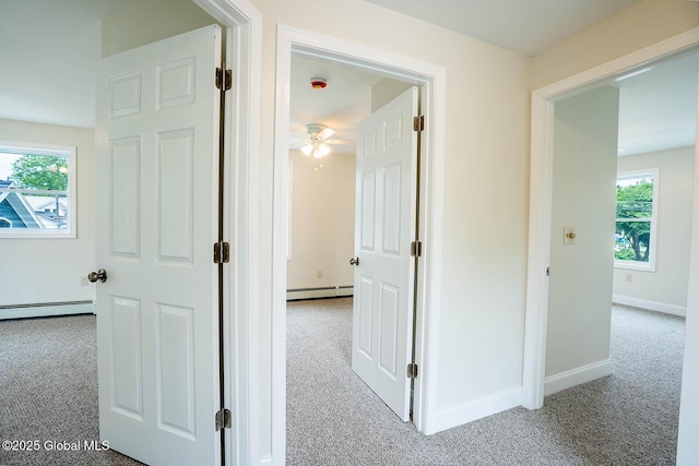 11 N Park St, White Creek, NY 12816 - hall featuring carpet flooring, a baseboard heating unit, and plenty of natural light