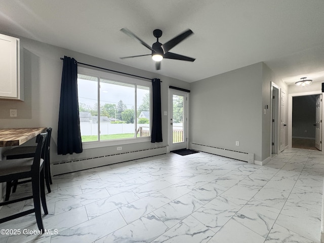 10 Kasper Dr, Colonie, NY 12211 - unfurnished dining area with light marble finish flooring, baseboard heating, a ceiling fan, and plenty of natural light