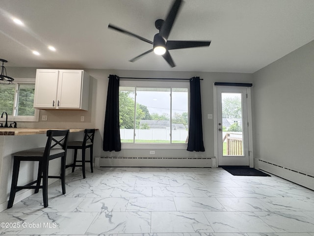 10 Kasper Dr, Colonie, NY 12211 - kitchen featuring light marble finish floors, recessed lighting, ceiling fan, healthy amount of natural light, and white cabinetry