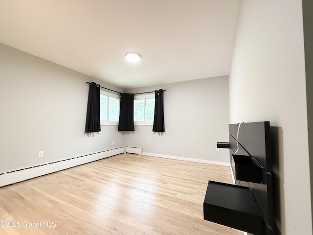 10 Kasper Dr, Colonie, NY 12211 - empty room featuring light wood-style flooring, baseboards, and baseboard heating