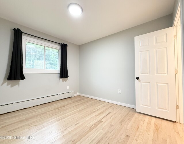 10 Kasper Dr, Colonie, NY 12211 - spare room featuring light wood finished floors, baseboards, and baseboard heating