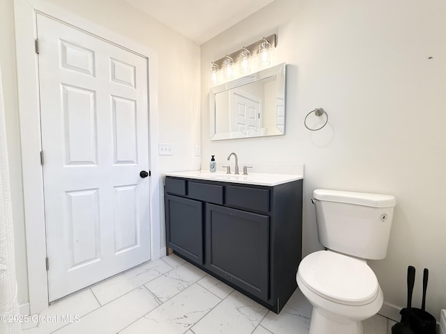 10 Kasper Dr, Colonie, NY 12211 - bathroom with marble look tile flooring, vanity, and toilet