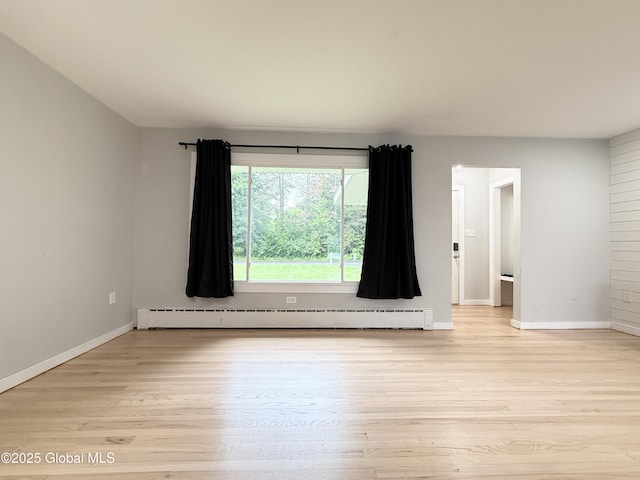 10 Kasper Dr, Colonie, NY 12211 - spare room featuring a baseboard radiator, light wood-style flooring, and baseboards