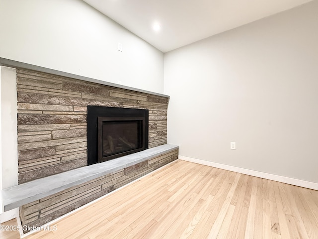 10 Kasper Dr, Colonie, NY 12211 - detailed view of a stone fireplace, wood finished floors, and baseboards