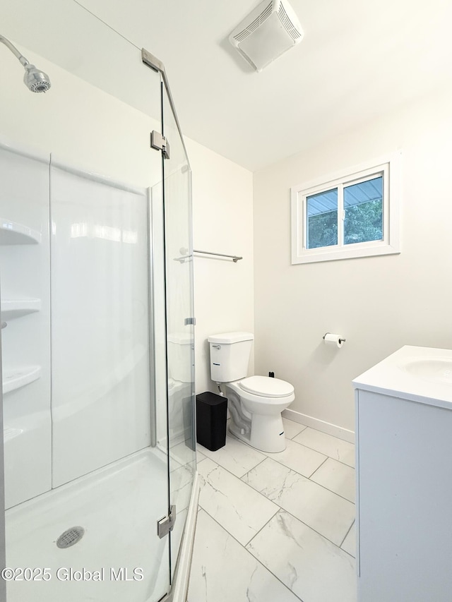 10 Kasper Dr, Colonie, NY 12211 - bathroom featuring marble look tiles, a stall shower, toilet, vanity, and baseboards