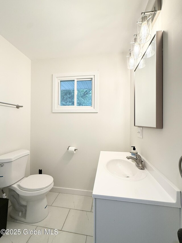10 Kasper Dr, Colonie, NY 12211 - bathroom featuring vanity, toilet, tile patterned floors, and baseboards