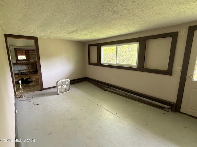116 Coons Rd, Middleburgh, NY 12122 - unfurnished room with a textured ceiling and concrete flooring