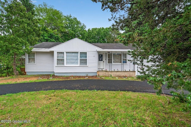 12 Haviland Ave, Glens Falls, NY 12801 - ranch-style home with a front yard, covered porch, and roof with shingles