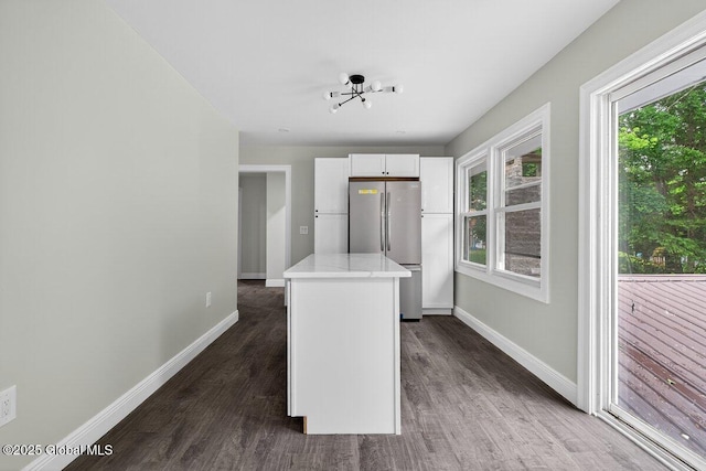 12 Haviland Ave, Glens Falls, NY 12801 - kitchen with freestanding refrigerator, baseboards, and dark wood-style flooring