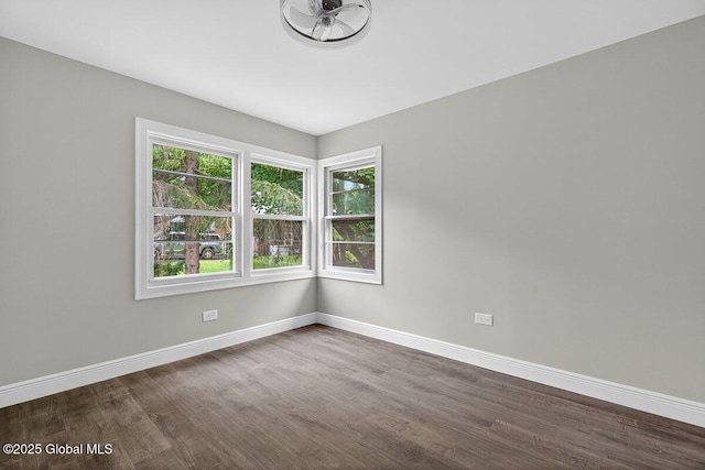 12 Haviland Ave, Glens Falls, NY 12801 - empty room with baseboards, dark wood-style flooring, and plenty of natural light