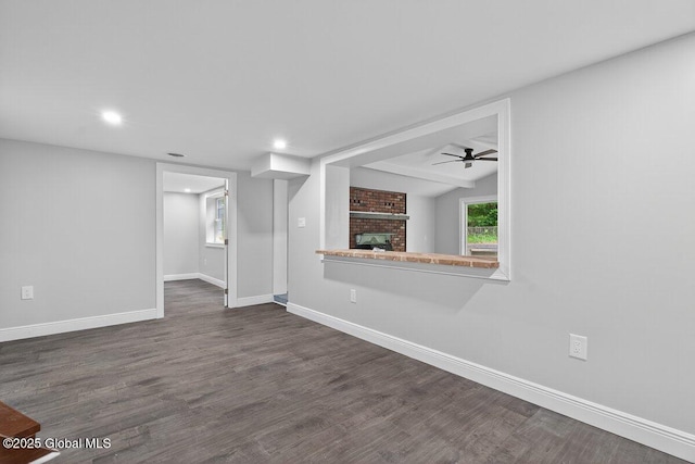 12 Haviland Ave, Glens Falls, NY 12801 - unfurnished living room with a fireplace, baseboards, dark wood-type flooring, ceiling fan, and recessed lighting