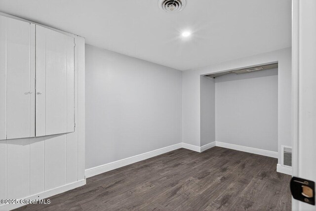 12 Haviland Ave, Glens Falls, NY 12801 - unfurnished bedroom featuring dark wood-style floors, baseboards, and recessed lighting