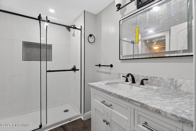 12 Haviland Ave, Glens Falls, NY 12801 - bathroom featuring a stall shower, vanity, and wood finished floors