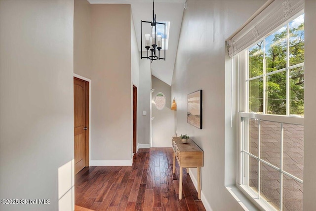 6 Maple Ter, Bethlehem, NY 12054 - corridor featuring dark wood finished floors, a towering ceiling, and a chandelier