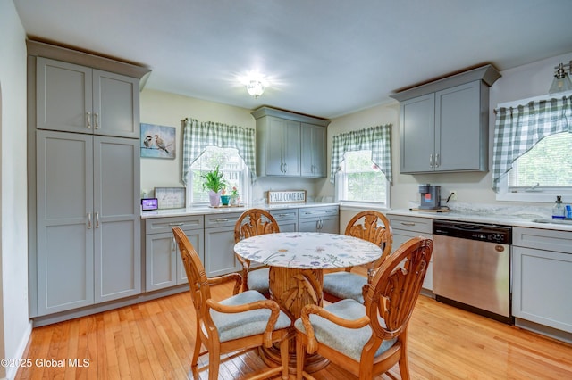 4 Tomohawk Pl, Johnstown, NY 12095 - kitchen featuring dishwasher, gray cabinetry, light wood-style floors, and light countertops