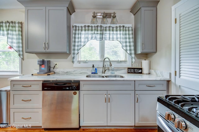 4 Tomohawk Pl, Johnstown, NY 12095 - kitchen with stainless steel appliances, gray cabinetry, plenty of natural light, and light stone counters