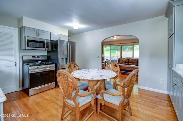 4 Tomohawk Pl, Johnstown, NY 12095 - dining room with light wood-style flooring and arched walkways