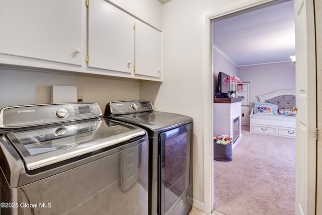 4 Tomohawk Pl, Johnstown, NY 12095 - washroom featuring cabinet space, washing machine and dryer, light colored carpet, and ornamental molding