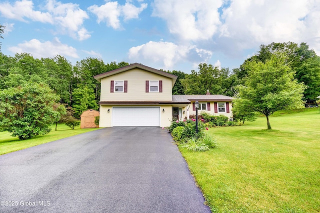 4 Tomohawk Pl, Johnstown, NY 12095 - split level home with an attached garage, driveway, a front yard, and a chimney