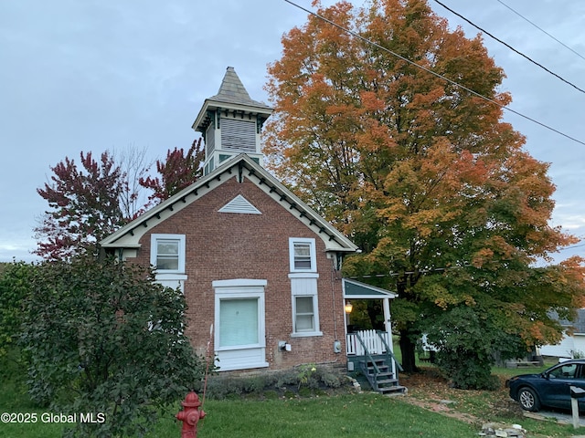 3 Meacham St, Port Henry, NY 12974 - view of front of house featuring brick siding and a front yard