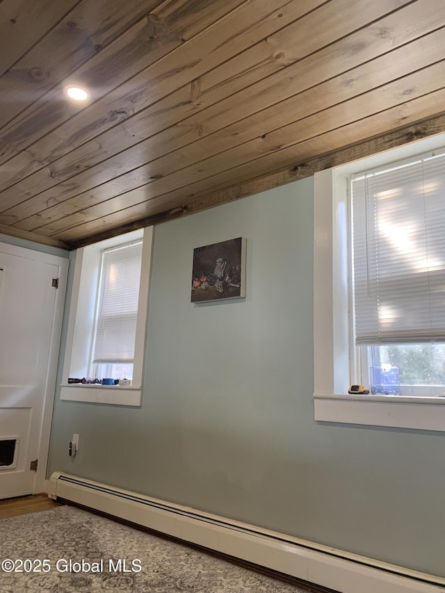 3 Meacham St, Port Henry, NY 12974 - basement with a baseboard heating unit and wooden ceiling