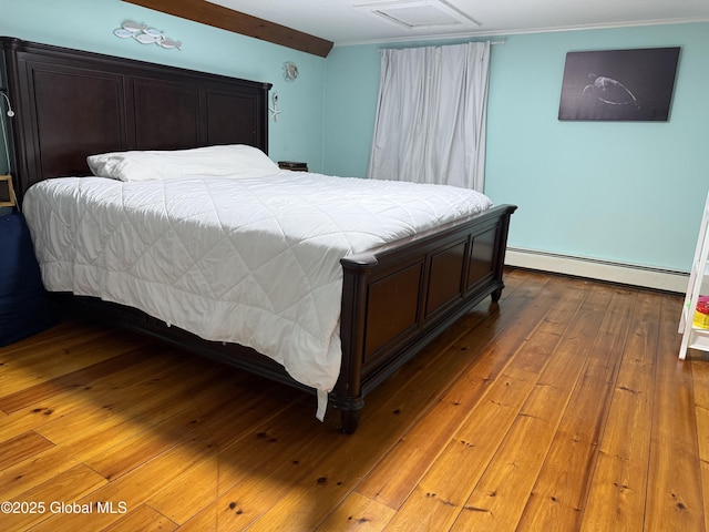 3 Meacham St, Port Henry, NY 12974 - bedroom with a baseboard radiator, attic access, crown molding, and wood-type flooring