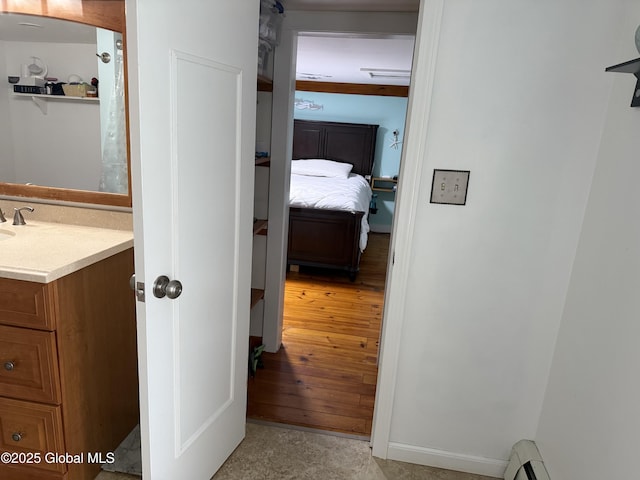 3 Meacham St, Port Henry, NY 12974 - corridor featuring a baseboard heating unit