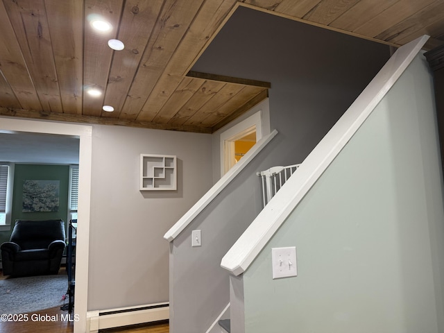 3 Meacham St, Port Henry, NY 12974 - staircase featuring wood ceiling, a baseboard radiator, recessed lighting, and wood finished floors