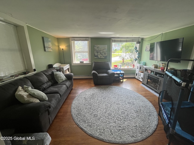 3 Meacham St, Port Henry, NY 12974 - living room with wood finished floors and a baseboard radiator