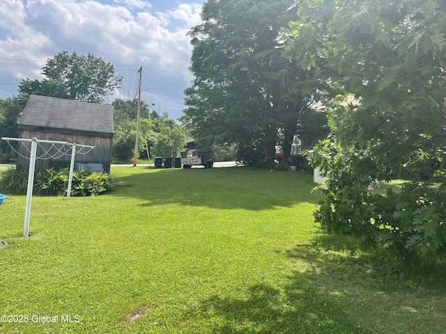 3 Meacham St, Port Henry, NY 12974 - view of green lawn with an outbuilding