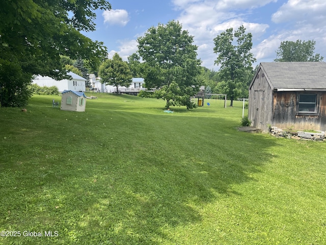 3 Meacham St, Port Henry, NY 12974 - view of green lawn with a shed and a playground