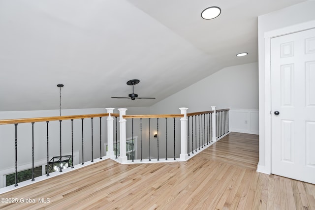 21 Jaipur Ln, Saratoga Springs, NY 12866 - hallway with wood finished floors, lofted ceiling, an upstairs landing, and a wainscoted wall