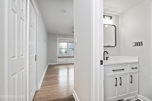 21 Jaipur Ln, Saratoga Springs, NY 12866 - corridor with light wood finished floors and baseboards