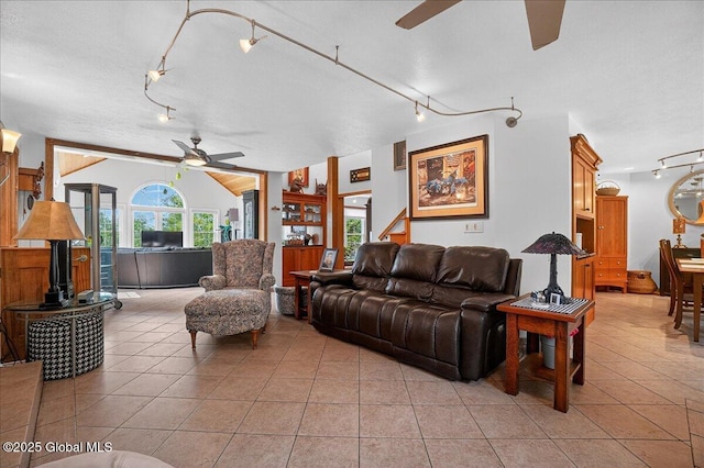 2034 Duanesburg Churches Rd, Duanesburg, NY 12053 - living area featuring a ceiling fan, rail lighting, light tile patterned floors, and vaulted ceiling