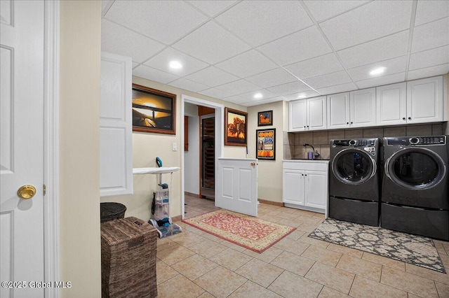 2034 Duanesburg Churches Rd, Duanesburg, NY 12053 - laundry room featuring cabinet space, washing machine and dryer, recessed lighting, and light tile patterned floors