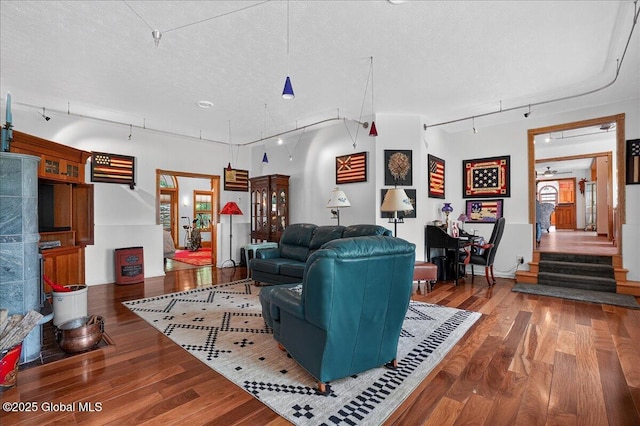 2034 Duanesburg Churches Rd, Duanesburg, NY 12053 - living area with rail lighting, wood finished floors, a textured ceiling, and stairway