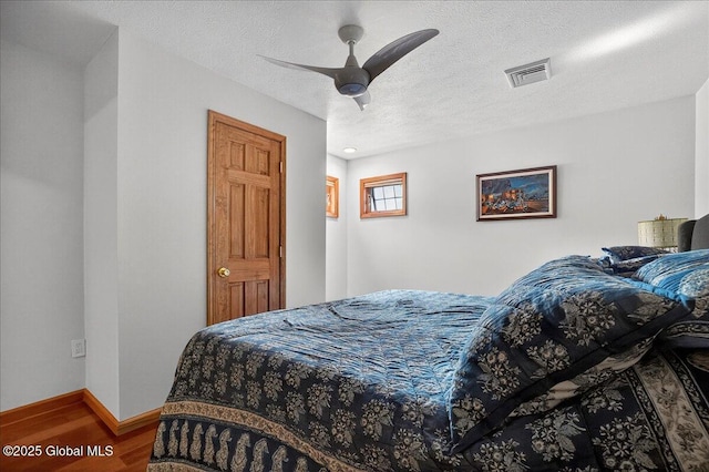 2034 Duanesburg Churches Rd, Duanesburg, NY 12053 - bedroom featuring wood finished floors, ceiling fan, and a textured ceiling