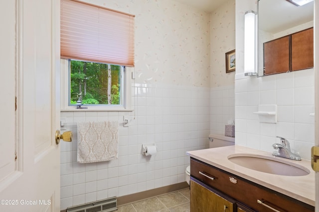 19 Tamarack Ln, Colonie, NY 12309 - bathroom with tile walls, vanity, tile patterned floors, wallpapered walls, and wainscoting