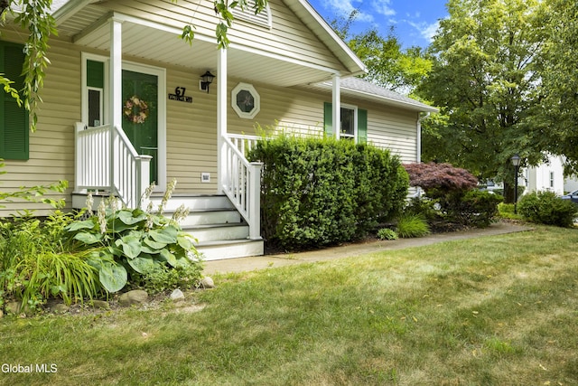 67 Victoria Way, Albany, NY 12209 - view of exterior entry featuring a yard and covered porch