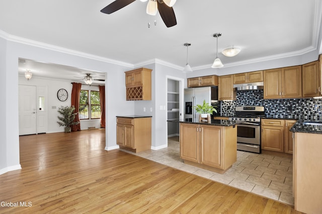 67 Victoria Way, Albany, NY 12209 - kitchen with appliances with stainless steel finishes, under cabinet range hood, ceiling fan, a kitchen island, and ornamental molding