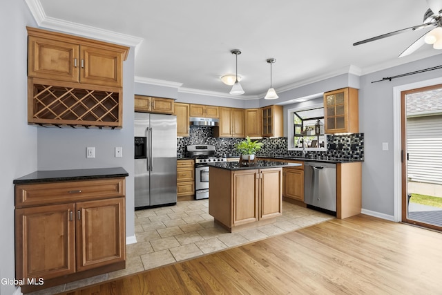 67 Victoria Way, Albany, NY 12209 - kitchen with appliances with stainless steel finishes, under cabinet range hood, backsplash, ceiling fan, and glass insert cabinets