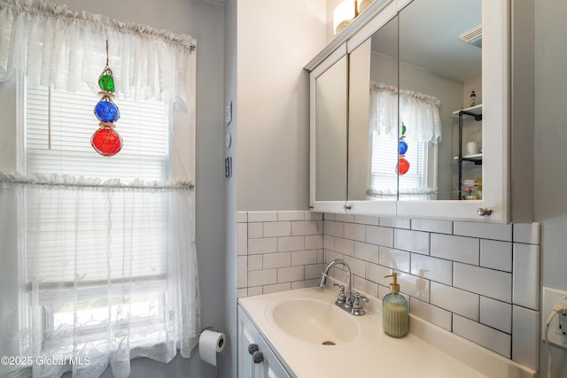 7 Bruce St, Scotia, NY 12302 - bathroom featuring vanity and tasteful backsplash