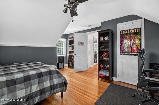 47 Mountainview Ter, North Greenbush, NY 12144 - bedroom featuring vaulted ceiling, light wood-style flooring, a desk, and ceiling fan